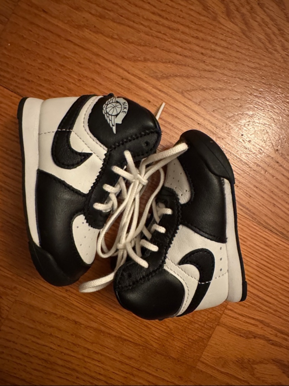 Nike Kids Black and White High-Top Sneakers with Wings Logo